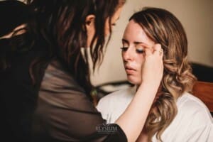 Gledswood Wedding - bride gets her lashes applied before the ceremony