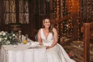 Gledswood wedding - bride listening to her groom making his speech