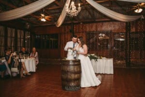 Gledswood wedding - bride and groom cutting their cake during the reception
