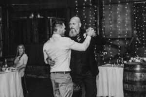 Gledswood wedding - the groom dances with the father of the bride