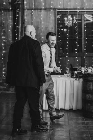 Gledswood wedding - the groom laughing with the father of the bride