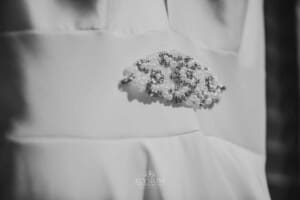 Gledswood Wedding - bridal gown details of jewelled broach