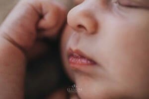 Newborn session - details of a baby boys lips and nose