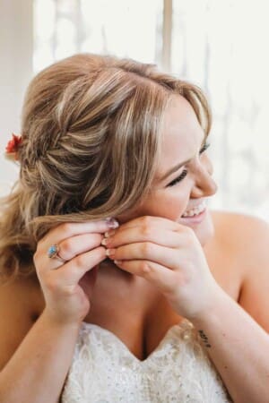 Gledswood Wedding Photo - Bride puts on her earrings