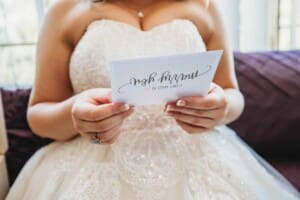 Gledswood Wedding Photo - bride reads her letter from the groom