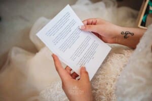 Gledswood Wedding Photo - bride reads her letter from the groom