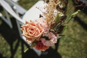 Gledswood Wedding Photo - ceremony floral details on a chair
