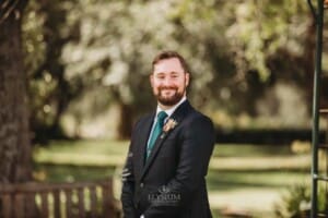 Gledswood Wedding Photo - groom watches his bride walk down the aisle