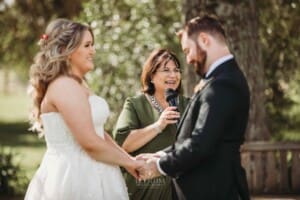 Gledswood Wedding Photo - wedding celebrant laughs during the ceremony