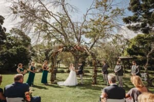 Gledswood Wedding Photo - bride and groom exchange wedding vows