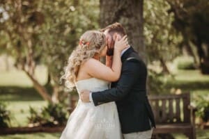 Gledswood Wedding Photo - bride and groom share their first kiss
