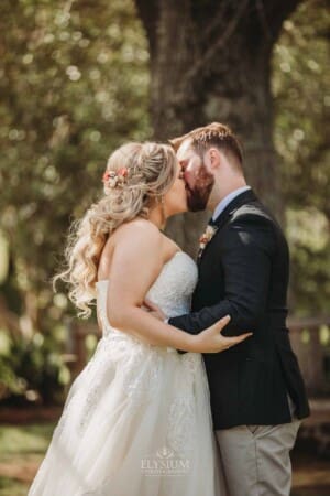 Gledswood Wedding Photo - bride and groom share their first kiss