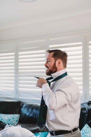 Gledswood Wedding Photo - Groom does up his tie