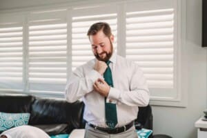 Gledswood Wedding Photo - Groom adjusts his cufflinks