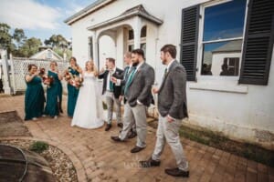 Gledswood Wedding Photo - bridal party toast with champagne glasses