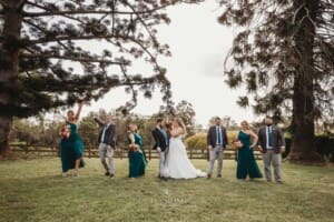 Gledswood Wedding Photo - the bridal party play games on the homestead lawn