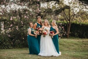 Gledswood Wedding Photo - the bride stands with her bridesmaids