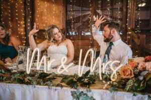 Gledswood Wedding Photo - bride and groom do an explosive fist pump