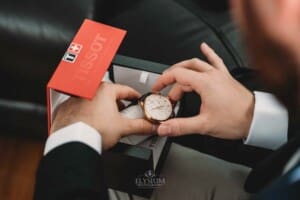 Gledswood Wedding Photo - Groom receives a gift from the bride