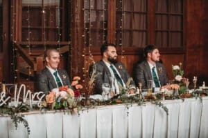 Gledswood Wedding Photo - the groomsmen listening to the Groom's speech