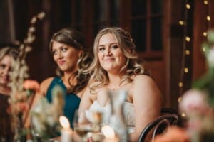 Gledswood Wedding Photo - the bride listening to the Groom's speech