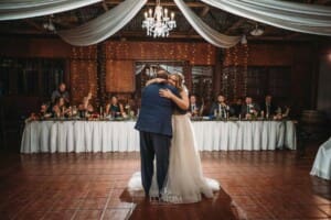 Gledswood Wedding Photo - the bride hugs her dad during their dance