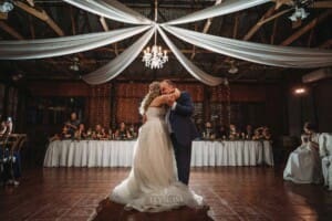 Gledswood Wedding Photo - the bride hugs her dad during their dance