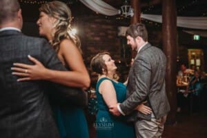 Gledswood Wedding Photo - the bridal party dance during the reception