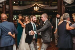 Gledswood Wedding Photo - the groom dances with his brother during the reception