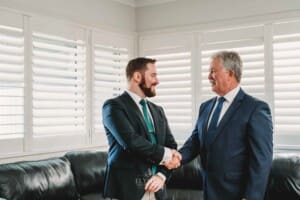 Gledswood Wedding Photo - Groom shakes hands with his dad
