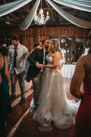 Gledswood Wedding Photo - the bride and groom dance during the reception