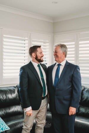 Gledswood Wedding Photo - Groom stands laughing with his dad
