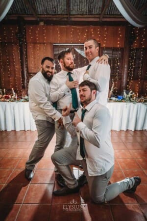 Gledswood Wedding Photo - groom and the groomsmen pose during the reception
