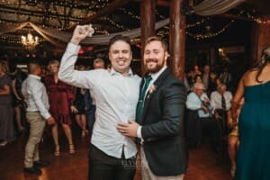 Gledswood Wedding Photo - a wedding guest catches the brides garter