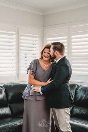 Gledswood Wedding Photo - Groom kisses his mum on the cheek