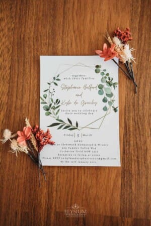 Gledswood Wedding Photo - Brides details with their wedding invitation