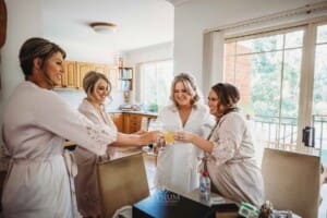Gledswood Wedding Photo - Bride makes a toast with her bridesmaids
