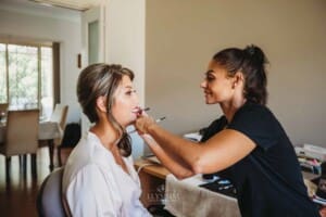 Gledswood Wedding Photo - Bridesmaid gets her makeup done