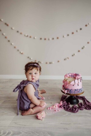 Cake Smash Session - baby girl eats her first birthday cake