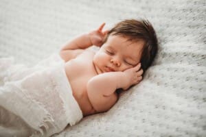 Baby Photography - a newborn has a sleepy stretch