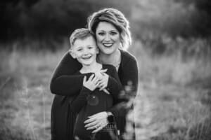Family Photograph - a mother cuddles her son at sunset
