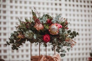 Burnham Grove Wedding - table florals set up at the wedding reception