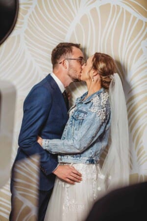 Burnham Grove Wedding - the bride and groom pose in the photo booth