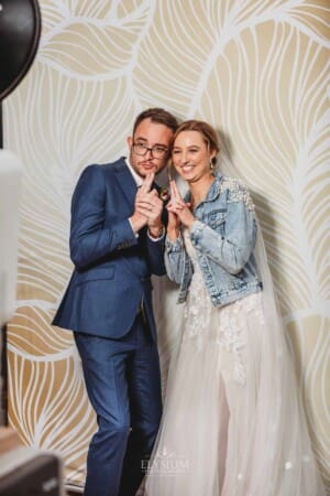 Burnham Grove Wedding - the bride and groom pose in the photo booth