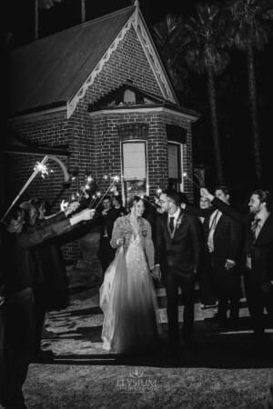 Burnham Grove Wedding - the bride and groom walk through their sparkler exit