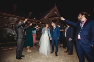 Burnham Grove Wedding - the bride and groom walk through their sparkler exit