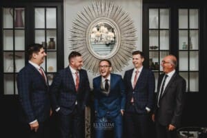 Burnham Grove Wedding - the groom has a laugh with his groomsmen