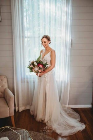 Burnham Grove Wedding - bride holds her bouquet before heading to the ceremony