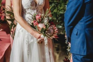 Burnham Grove Wedding - bride holds her bouquet during the ceremony