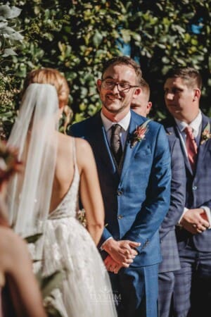 Burnham Grove Wedding - groom looks lovingly at his bride